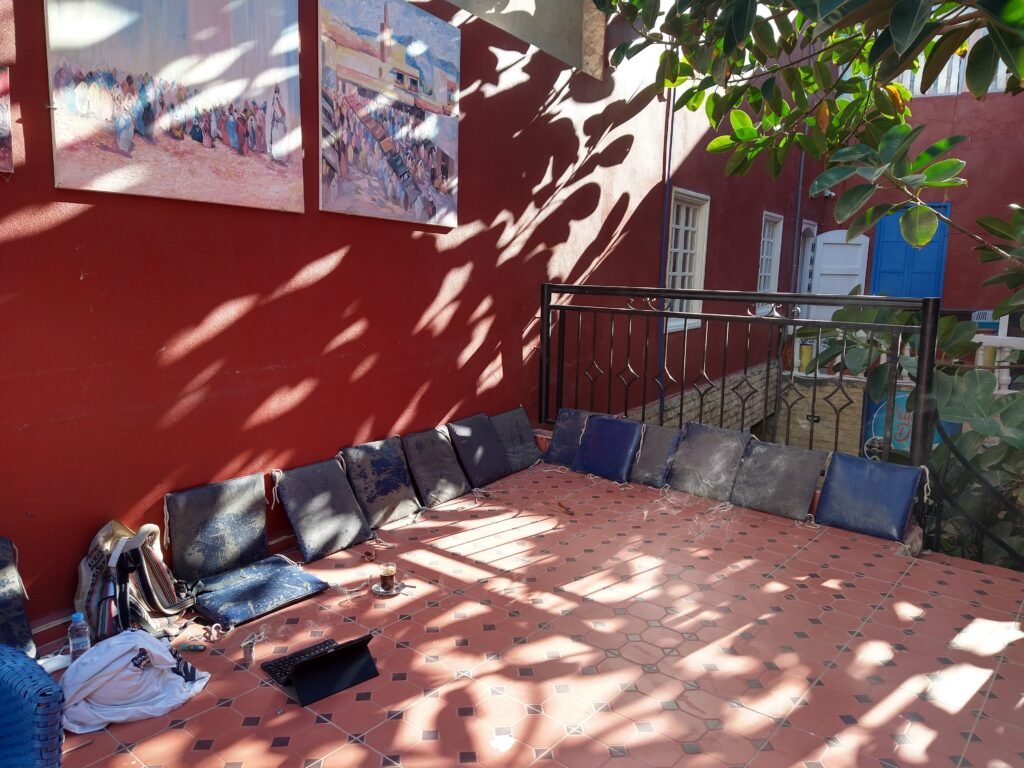 upper floor of cafe, closed of, my stuff on the ground tablet, coffee, some pillows