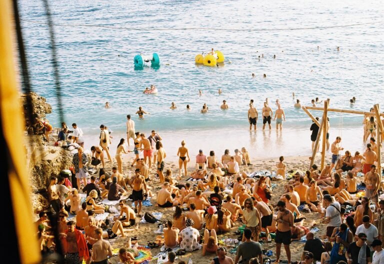 many people on little bay blue water sunshine